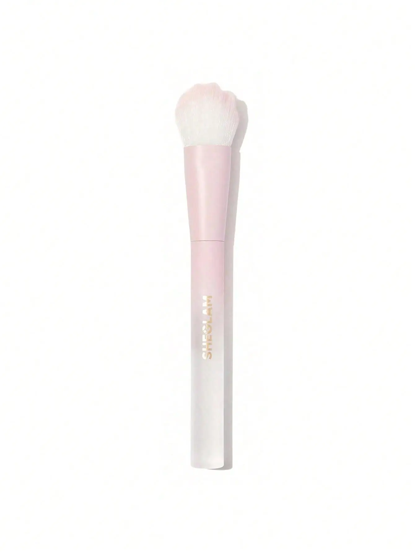 Pink makeup brush with white bristles on plain white background