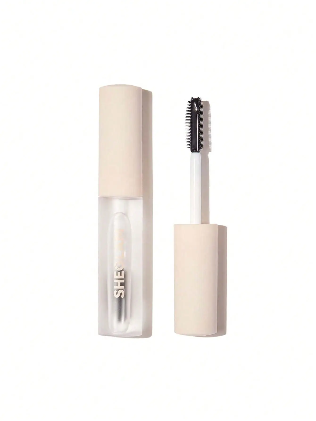 Clear mascara container and brush with beige handles on white background