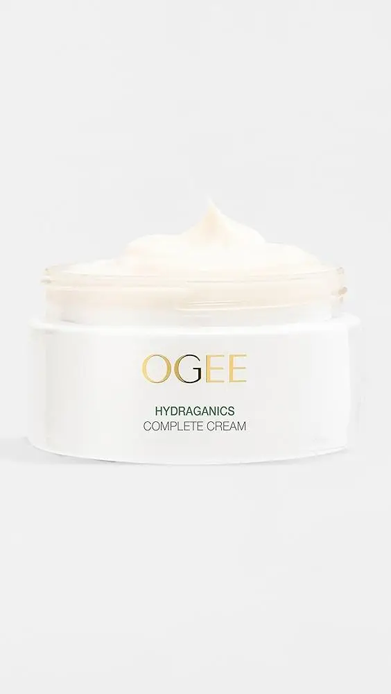 Cream-colored hydrating face cream in a clear jar on a white background
