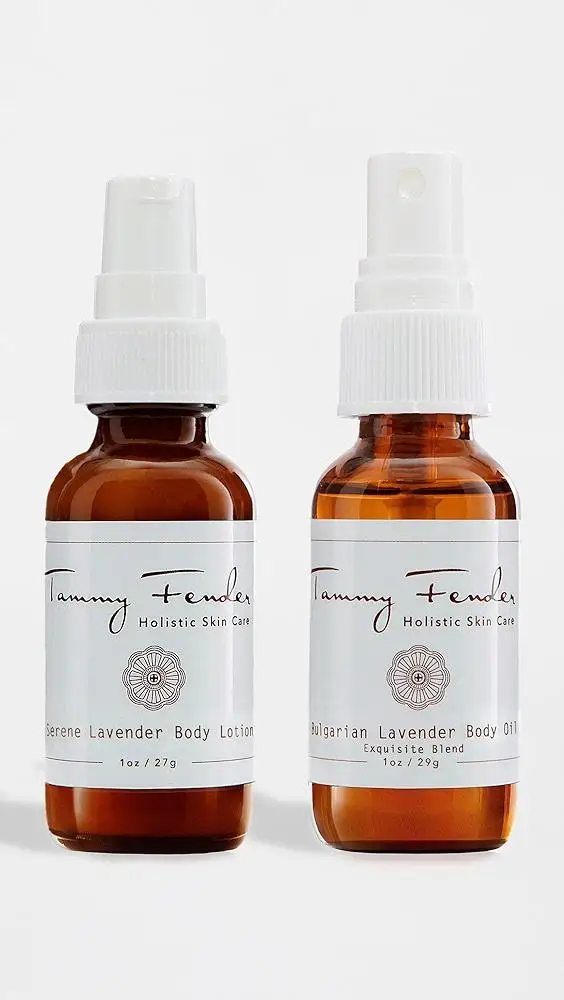 Two amber bottles with white labels and spray tops on white background