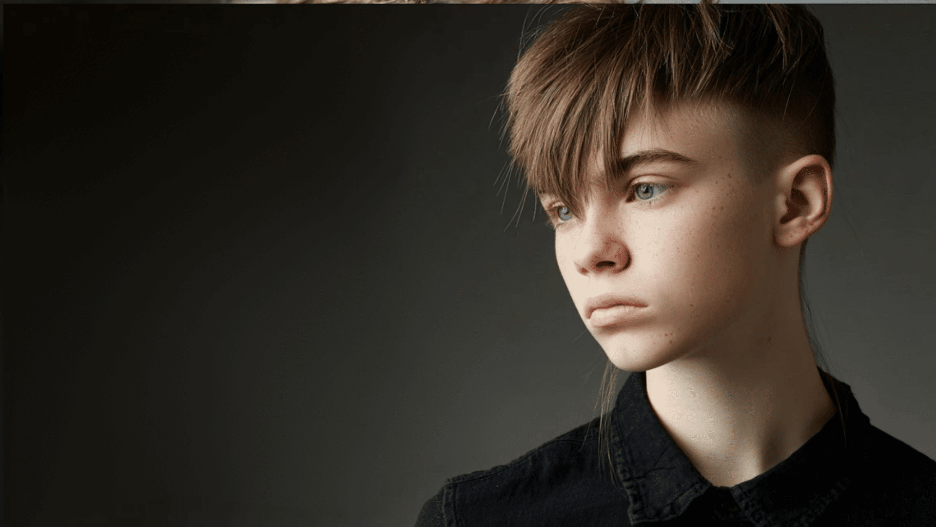 Angular fringe haircut with sharp geometric styling