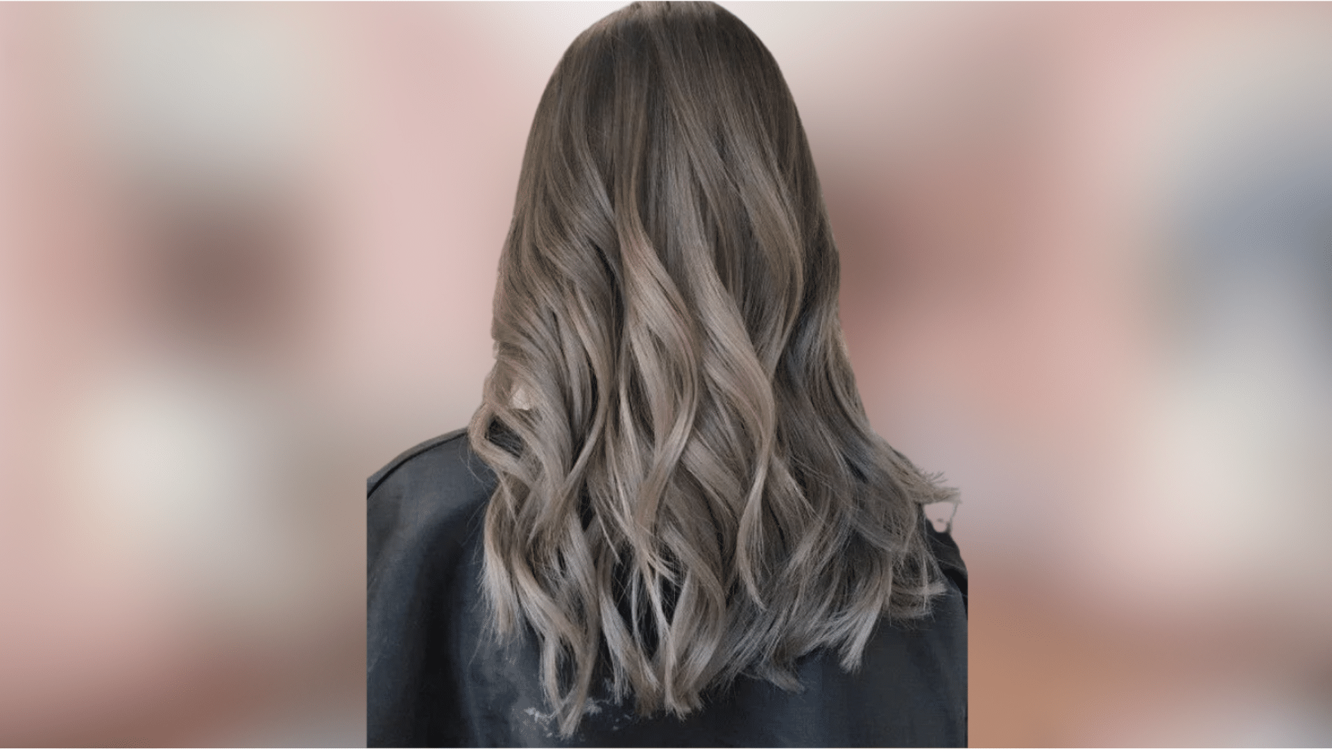 Wavy shoulder length hair featuring sleek ash blonde color with cool grey undertones and soft texture