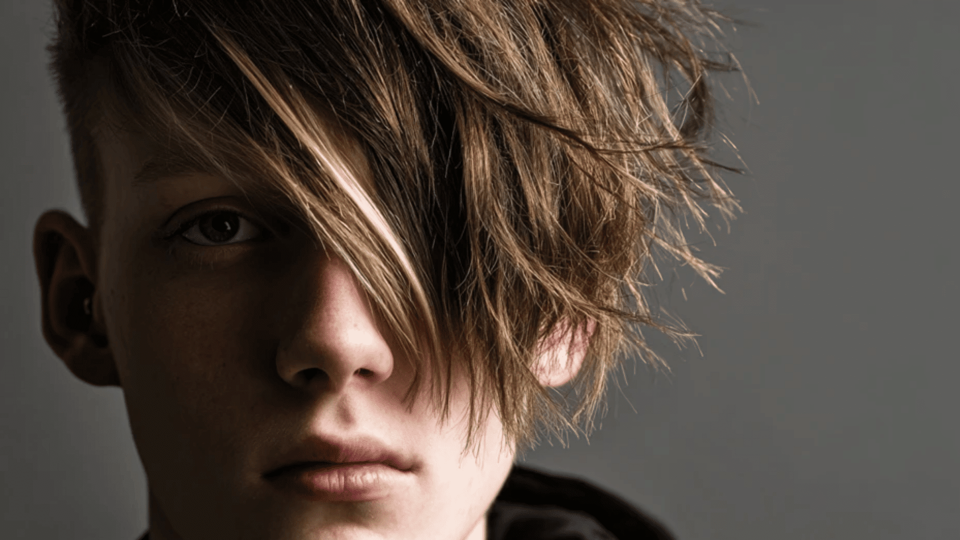 Asymmetrical haircut with unique creative styling for teens
