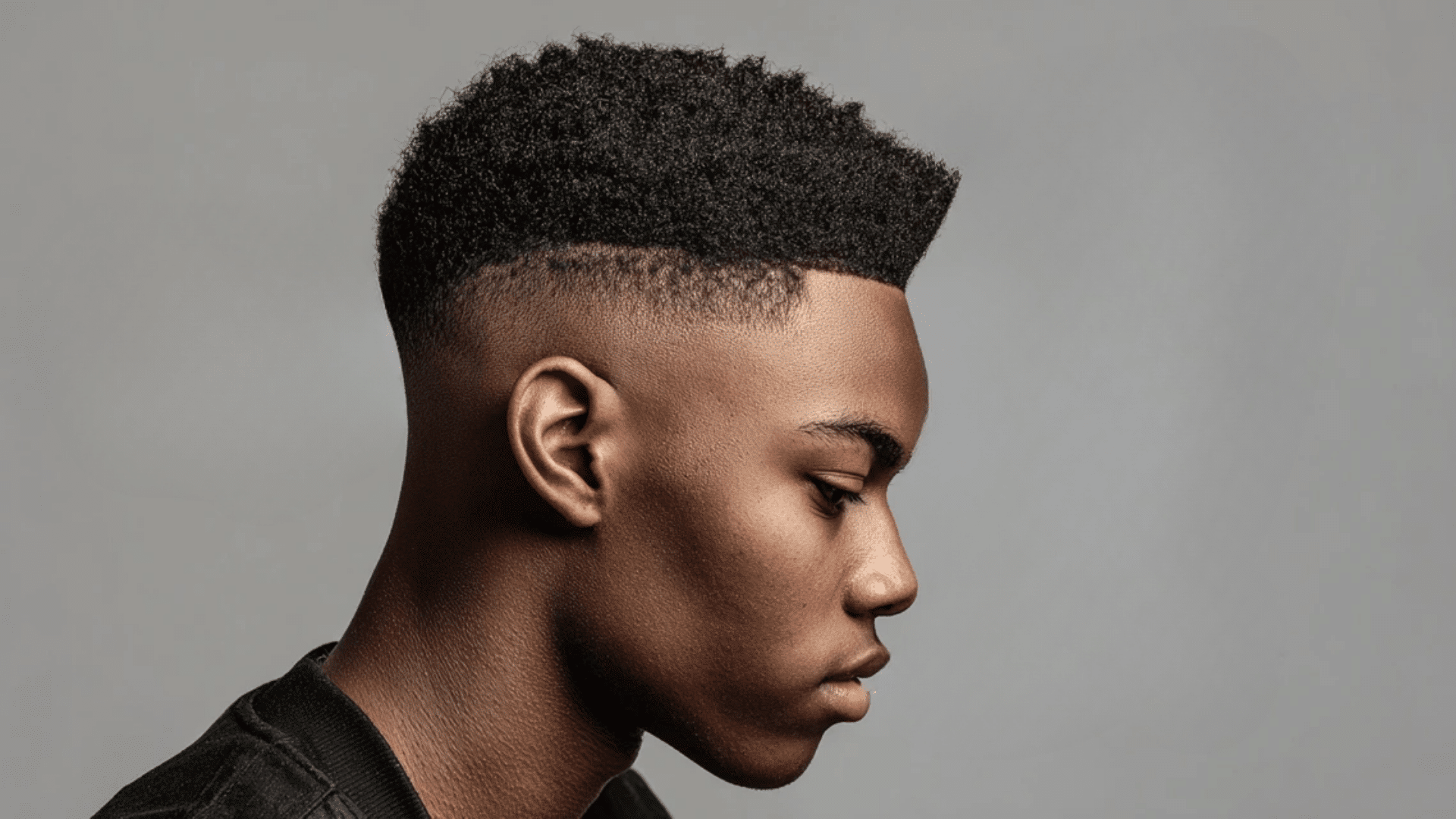 Burst fade haircut with curved modern design