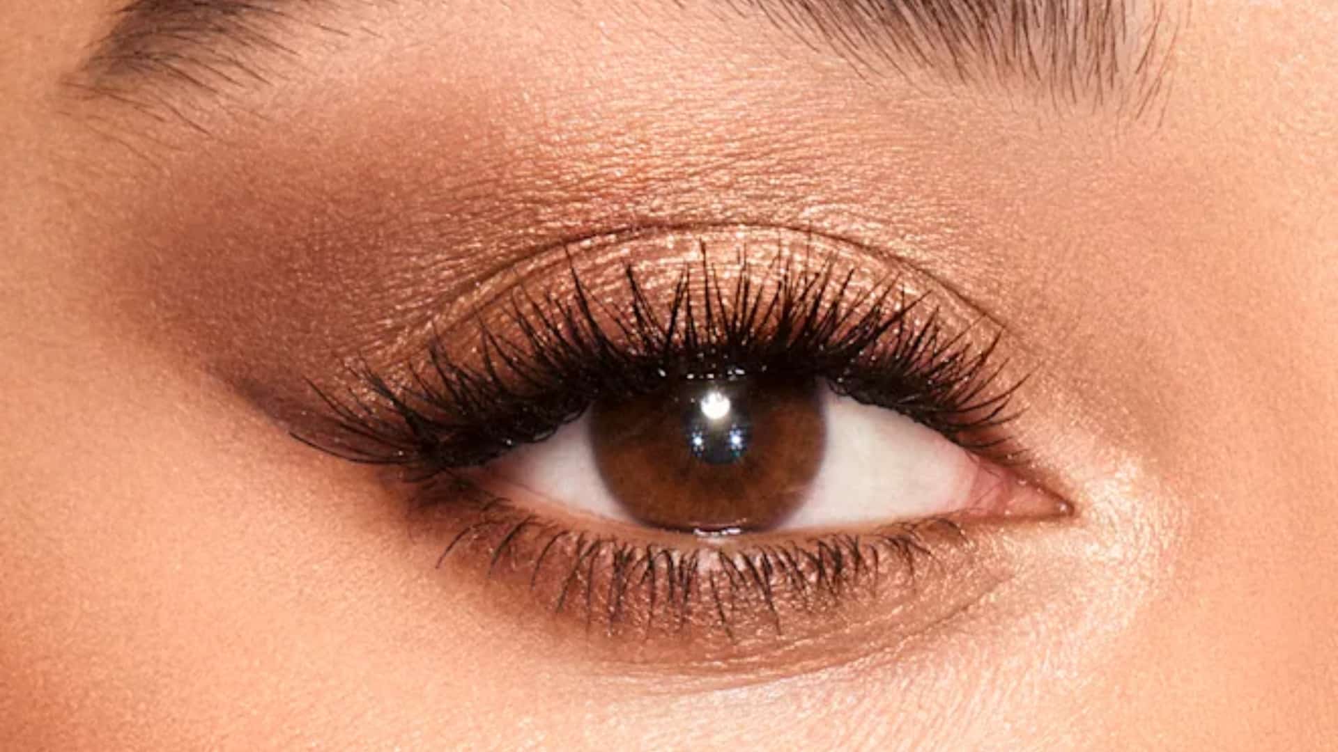 Woman wearing warm bronze eyeshadow with a subtle metallic finish and natural everyday makeup.