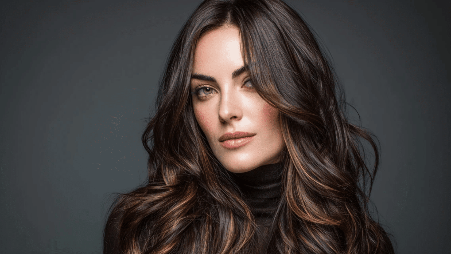Cool ash highlights on a rich brunette balayage base
