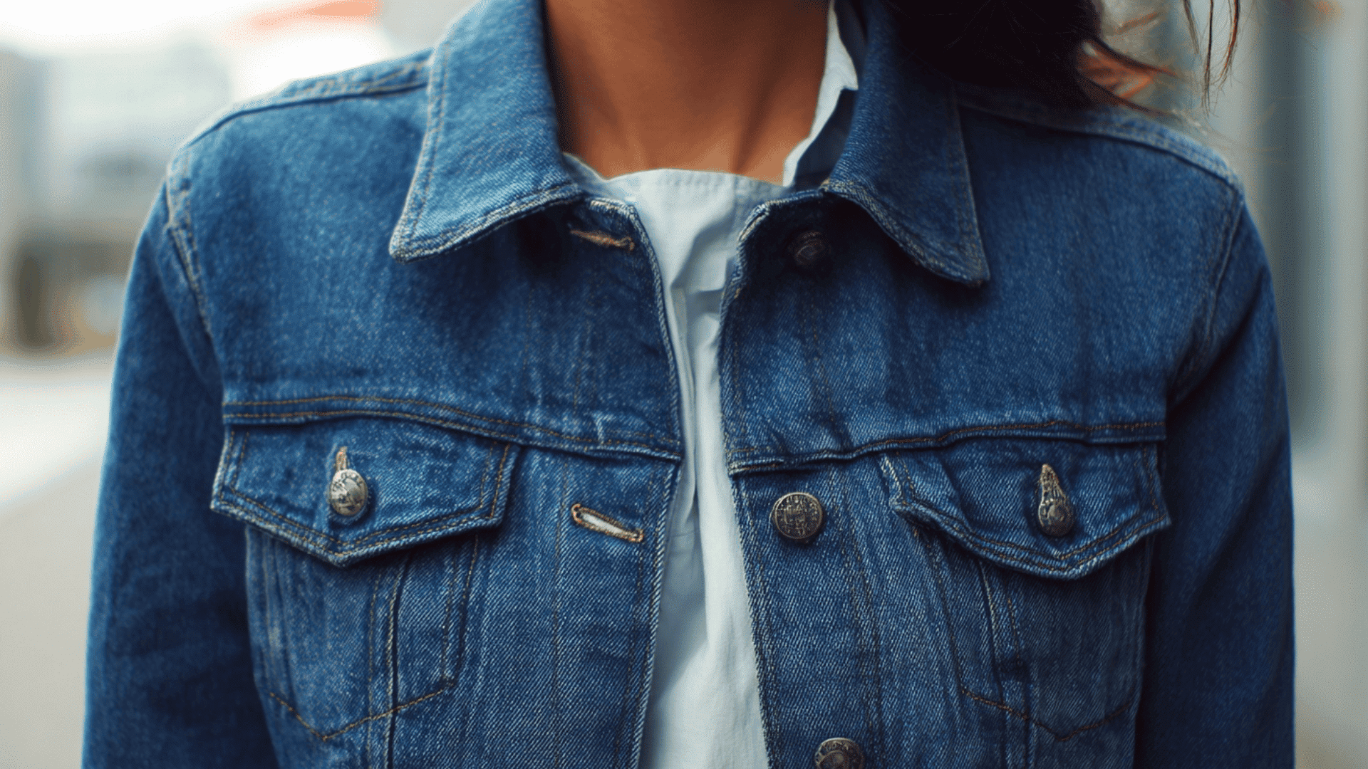 Blue denim jacket with button front and timeless casual layering design