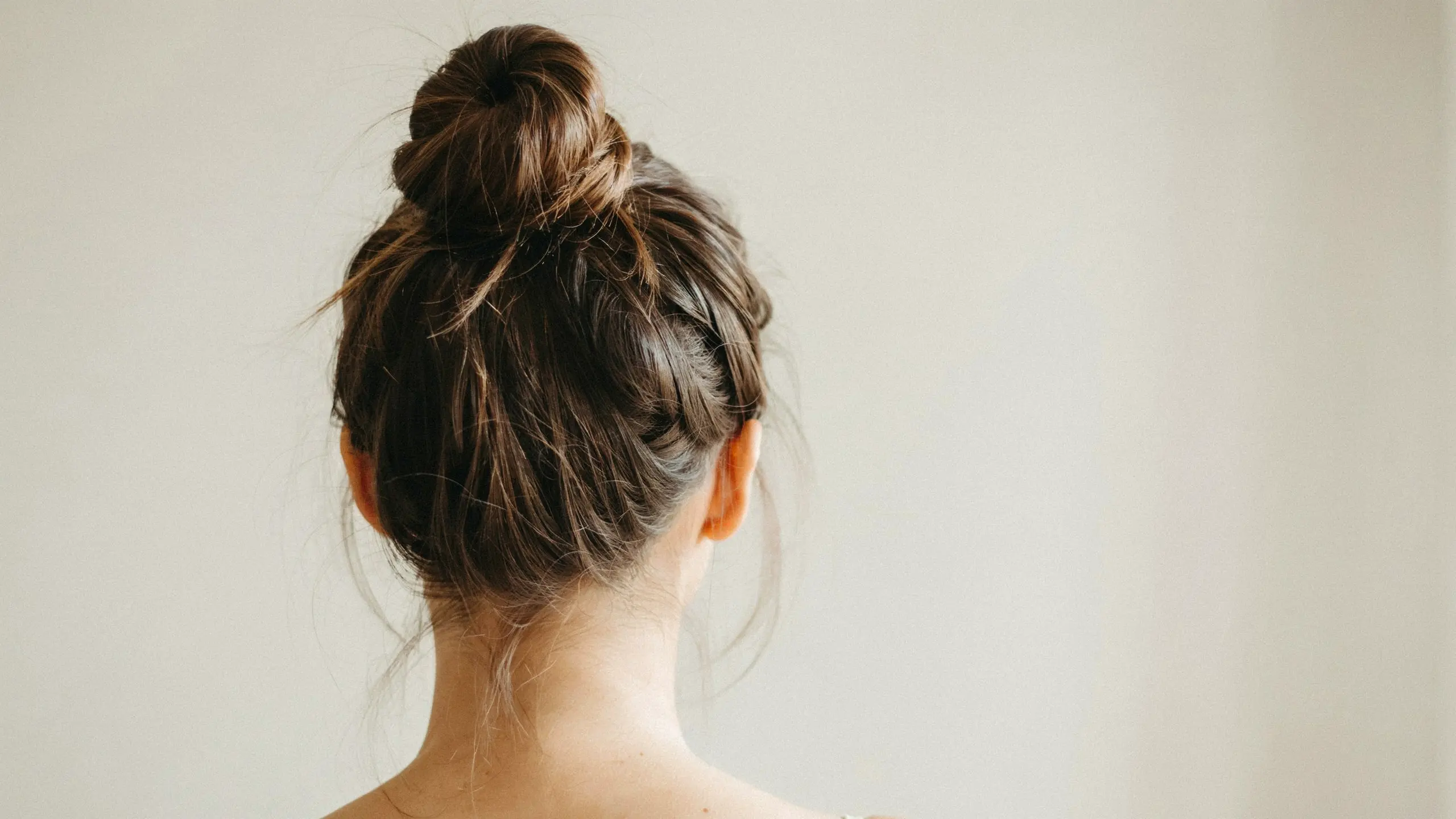 Easy top knot, a quick pick among effortless updo hairstyles