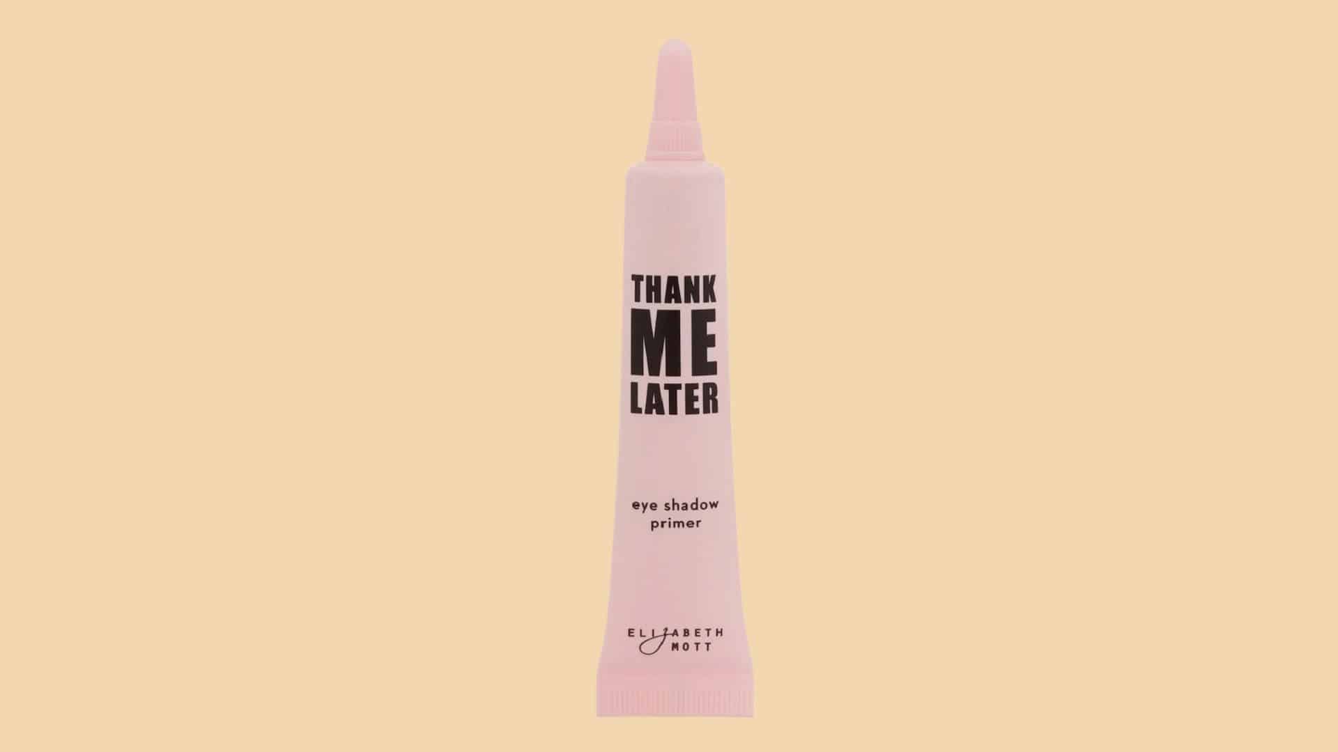 Elizabeth Mott Thank Me Later eye shadow primer tube displayed on a soft beige background