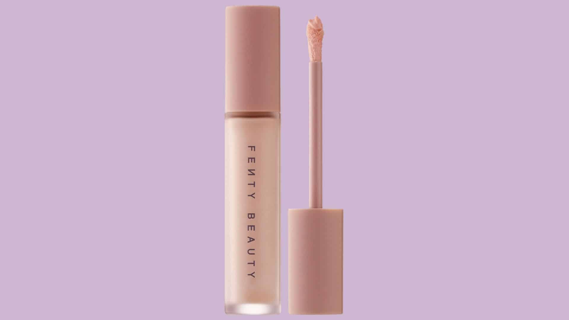 Fenty Beauty Pro Filt’r Amplifying Eye Primer tube and applicator on a pastel purple background