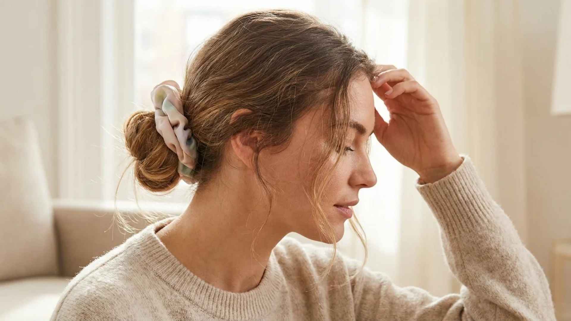 Soft scrunchies and gentle hair ties displayed to prevent tension and reduce hairstyle damage