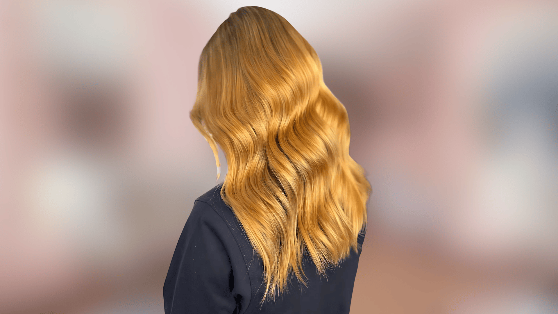 Soft wavy hair featuring golden copper shade with warm radiant undertones