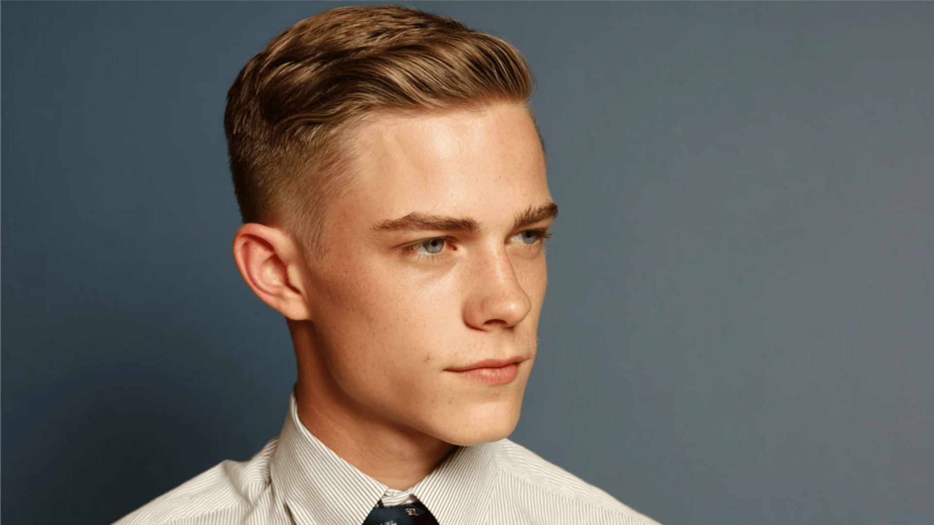 Hard part comb over haircut with polished styling