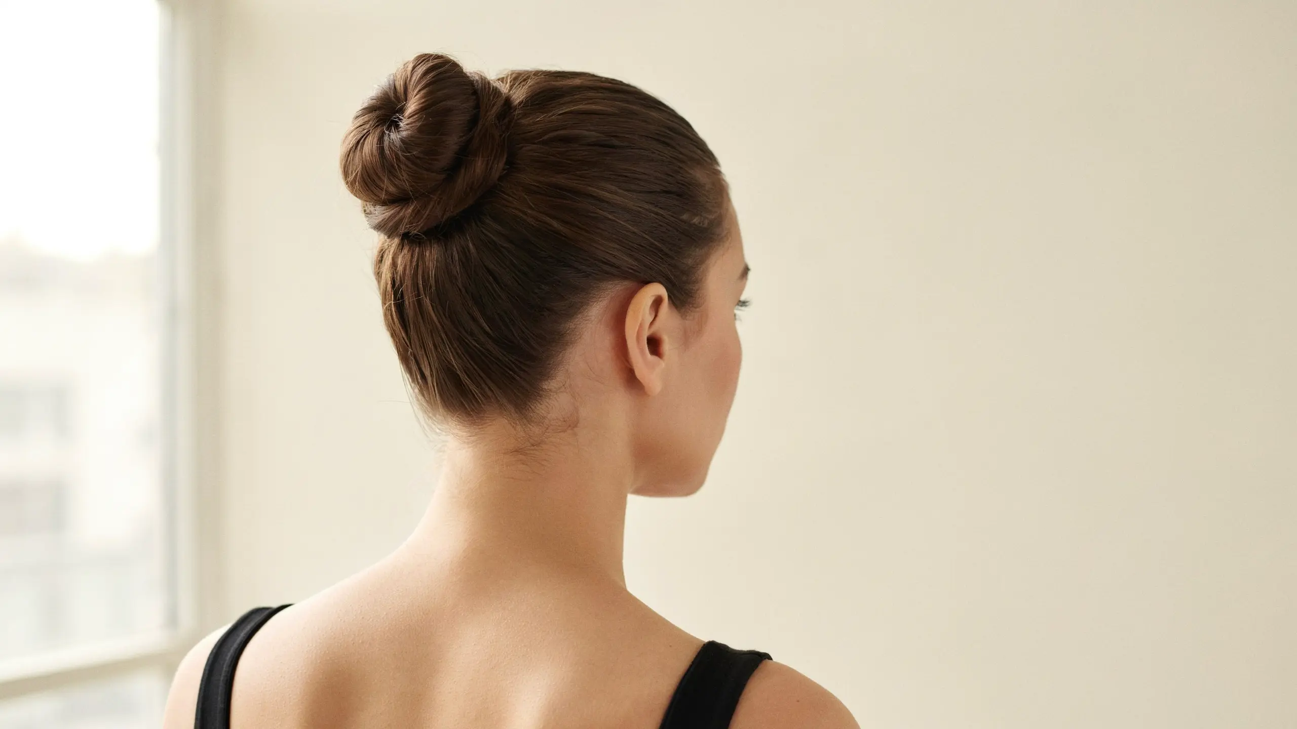 High bun, a sleek pick among classic updo hairstyles
