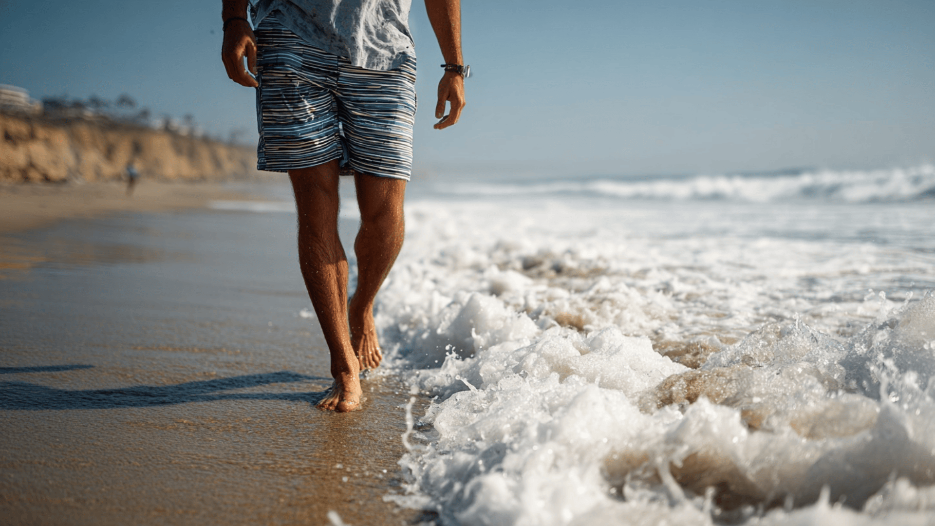 Man wearing quick dry hybrid shorts suitable for both swimming and casual summer wear.