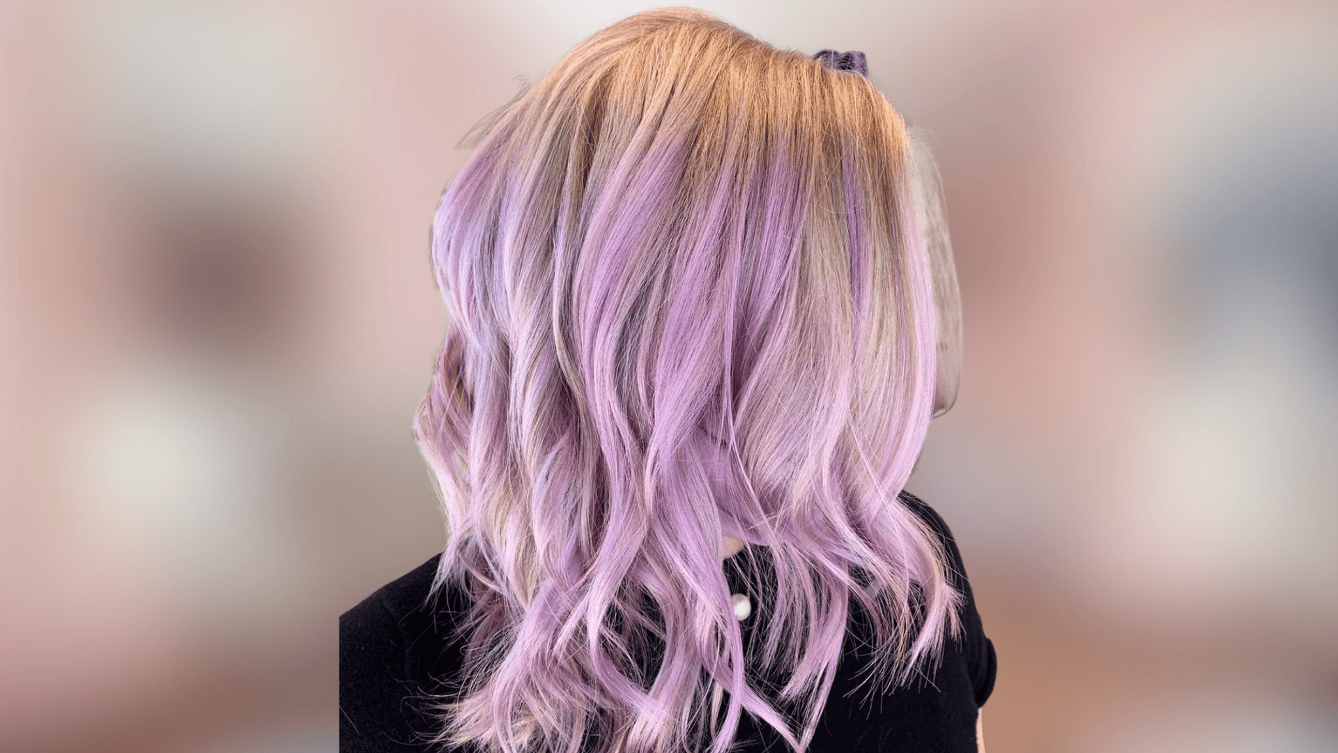 Wavy hairstyle featuring lavender blonde hair color with subtle cool pastel hues