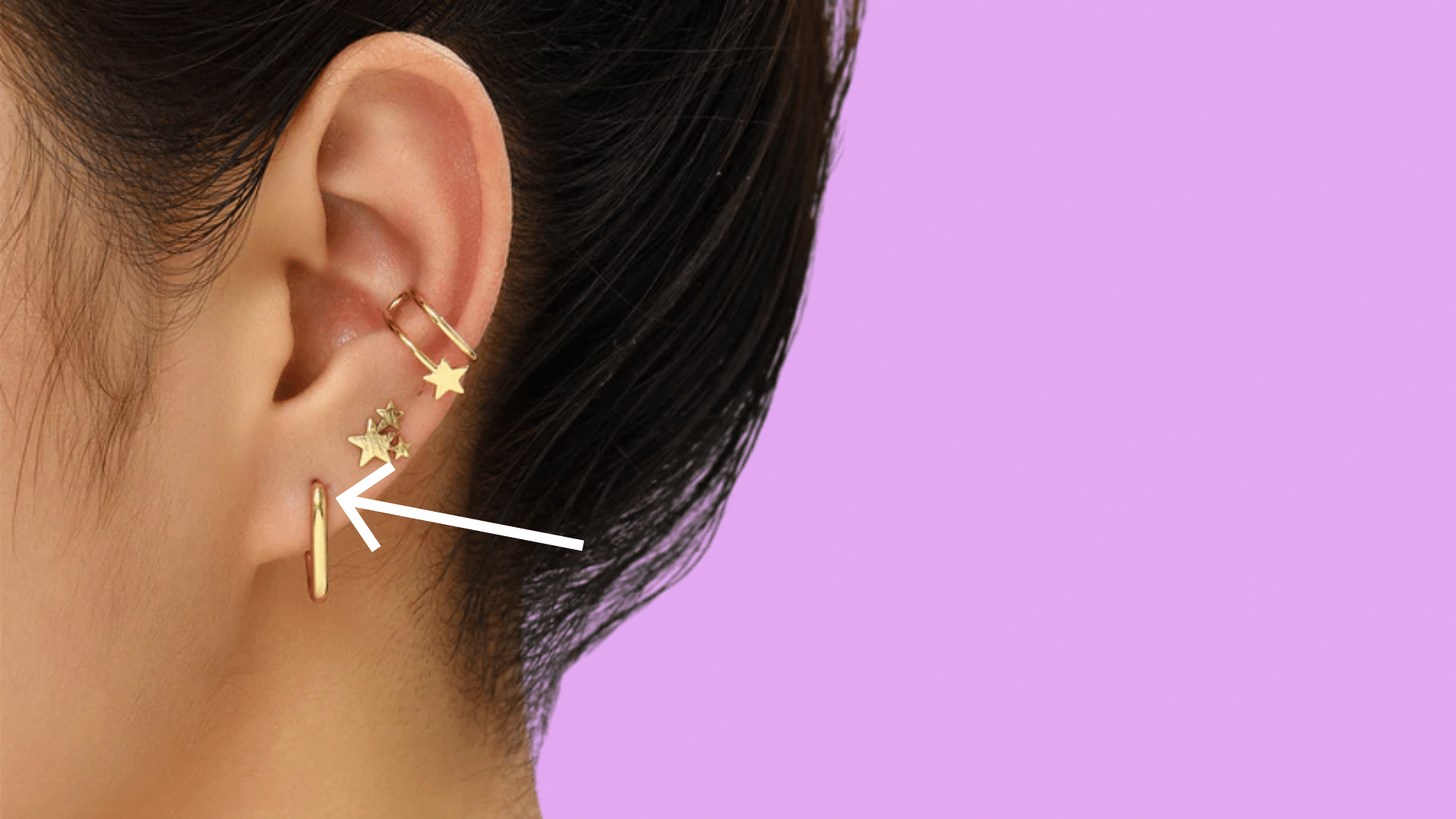 Low helix piercing placement near the earlobe on lower ear cartilage