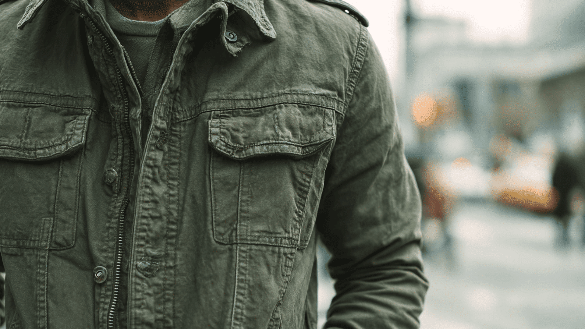 Military jacket with structured fit, cargo pockets, and utility inspired details