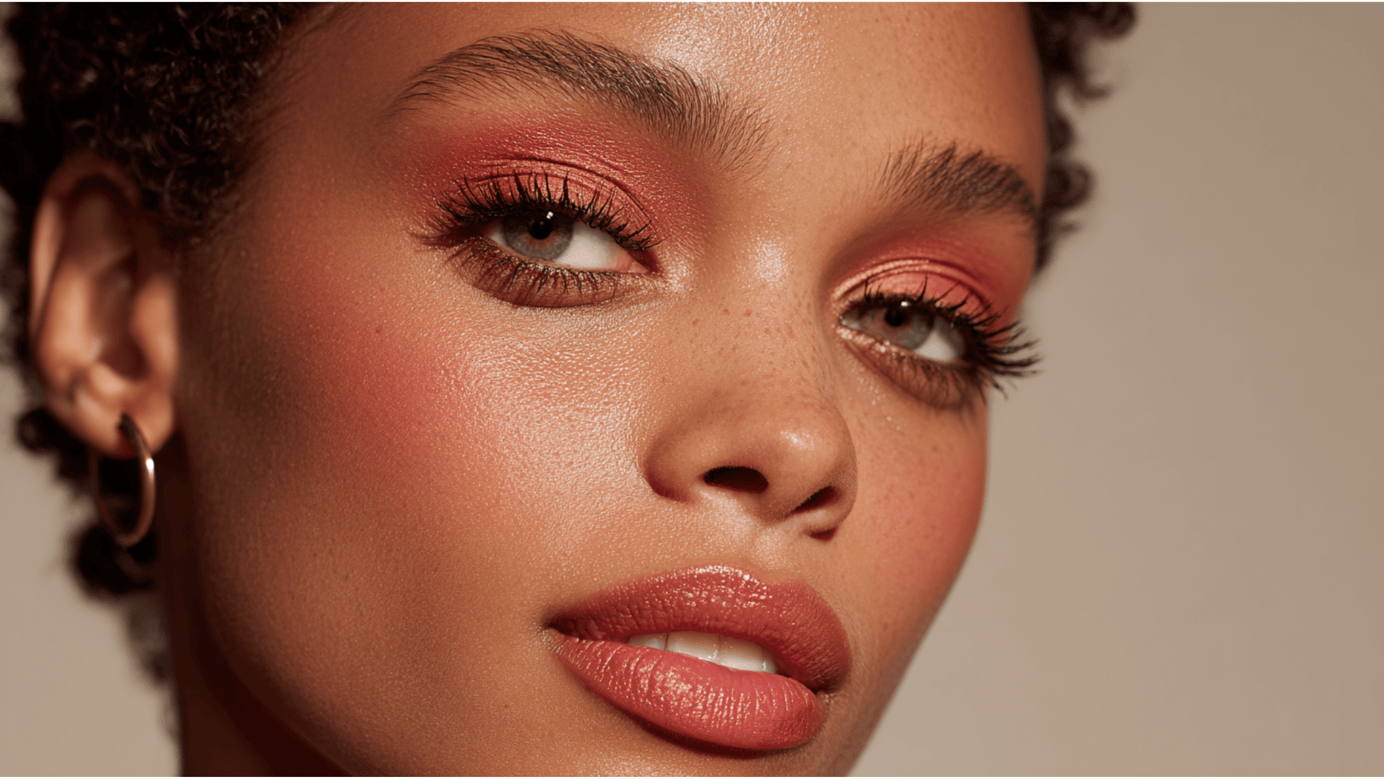 Monochromatic makeup look with matching warm tones across eyes, cheeks, and lips for a cohesive style