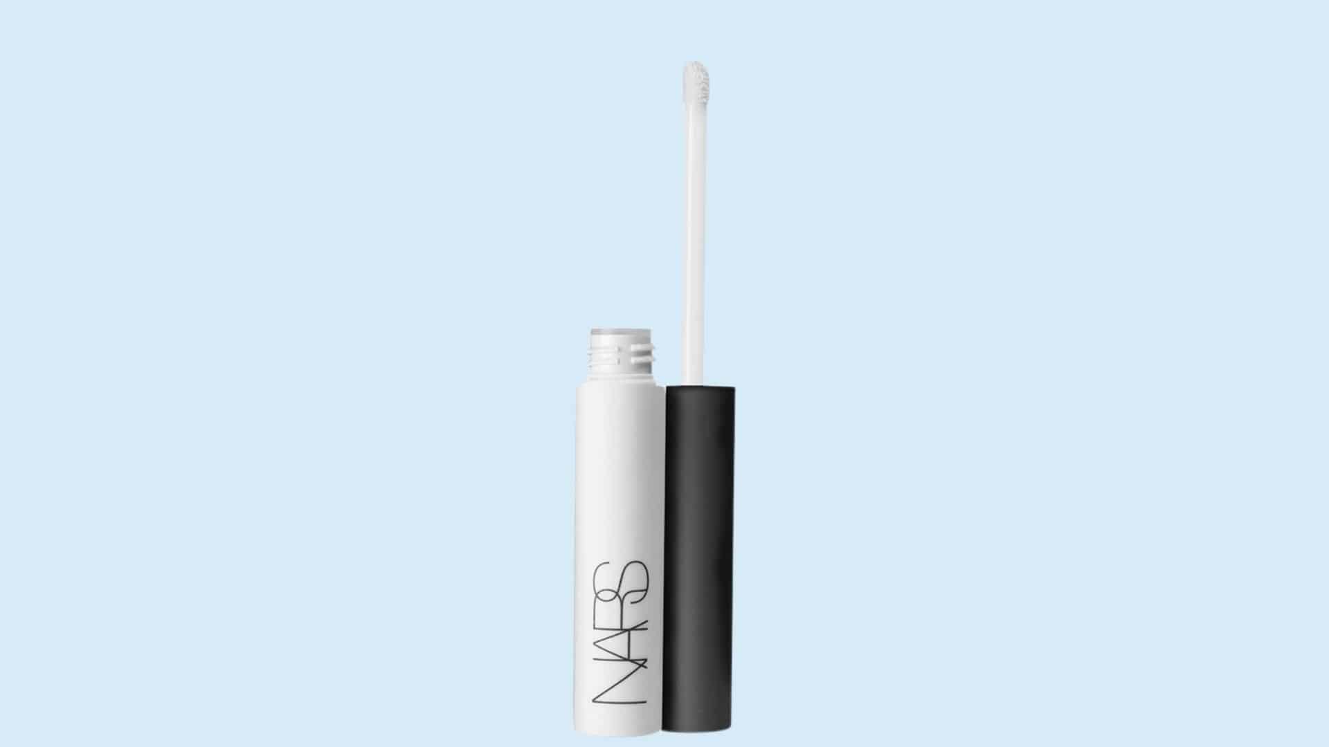 NARS Pro Prime Smudge Proof Eyeshadow Base tube with applicator on a light blue background