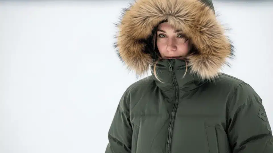 Insulated parka jacket with fur trimmed hood designed for cold winter weather
