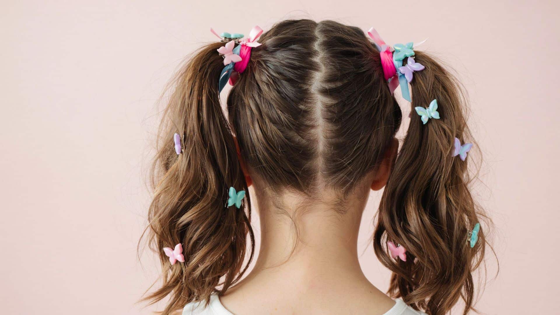 Early 2000s pigtails decorated with colorful clips and playful hair accessories.