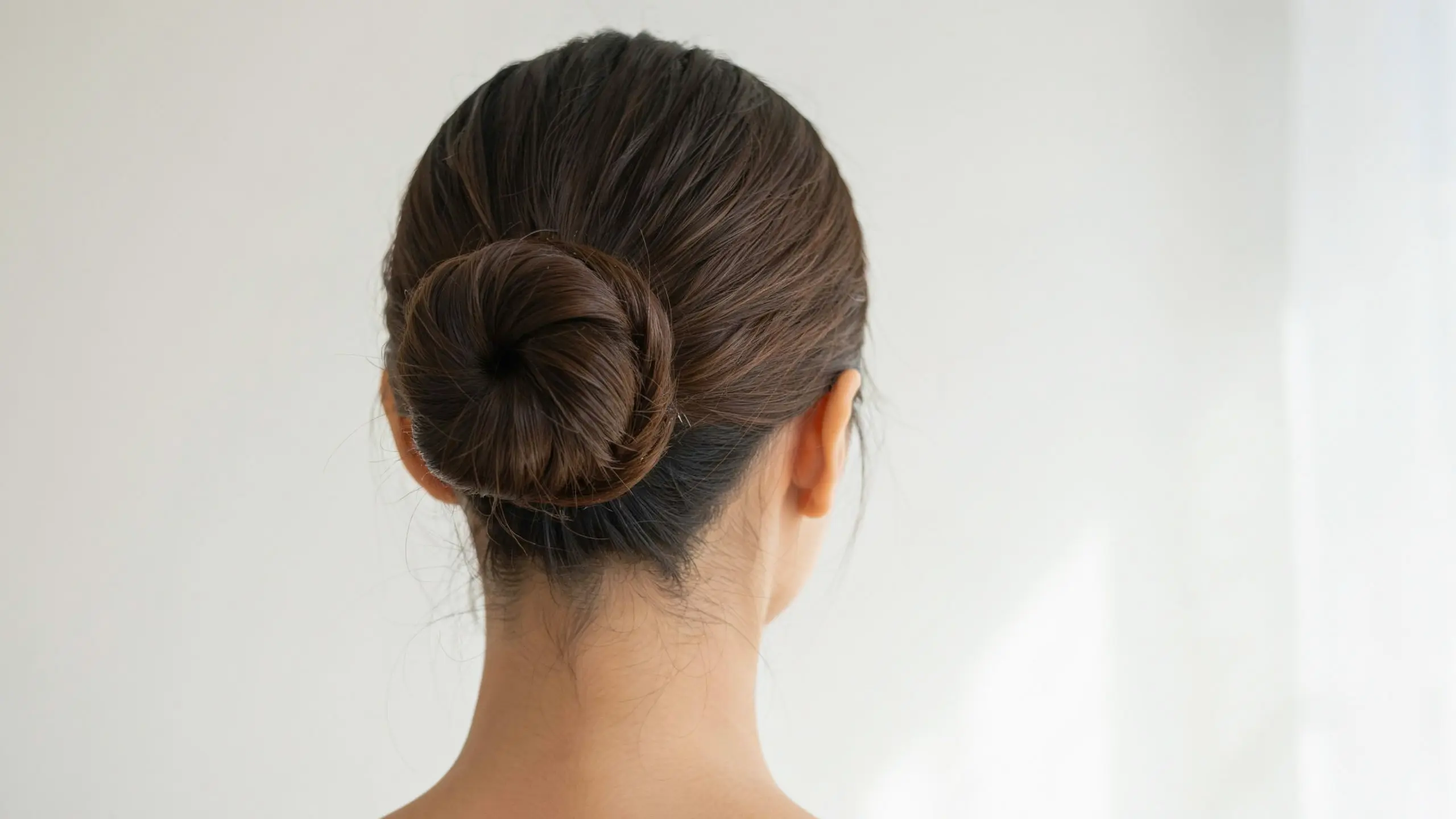 Ponytail bun, a polished option among simple updo hairstyles
