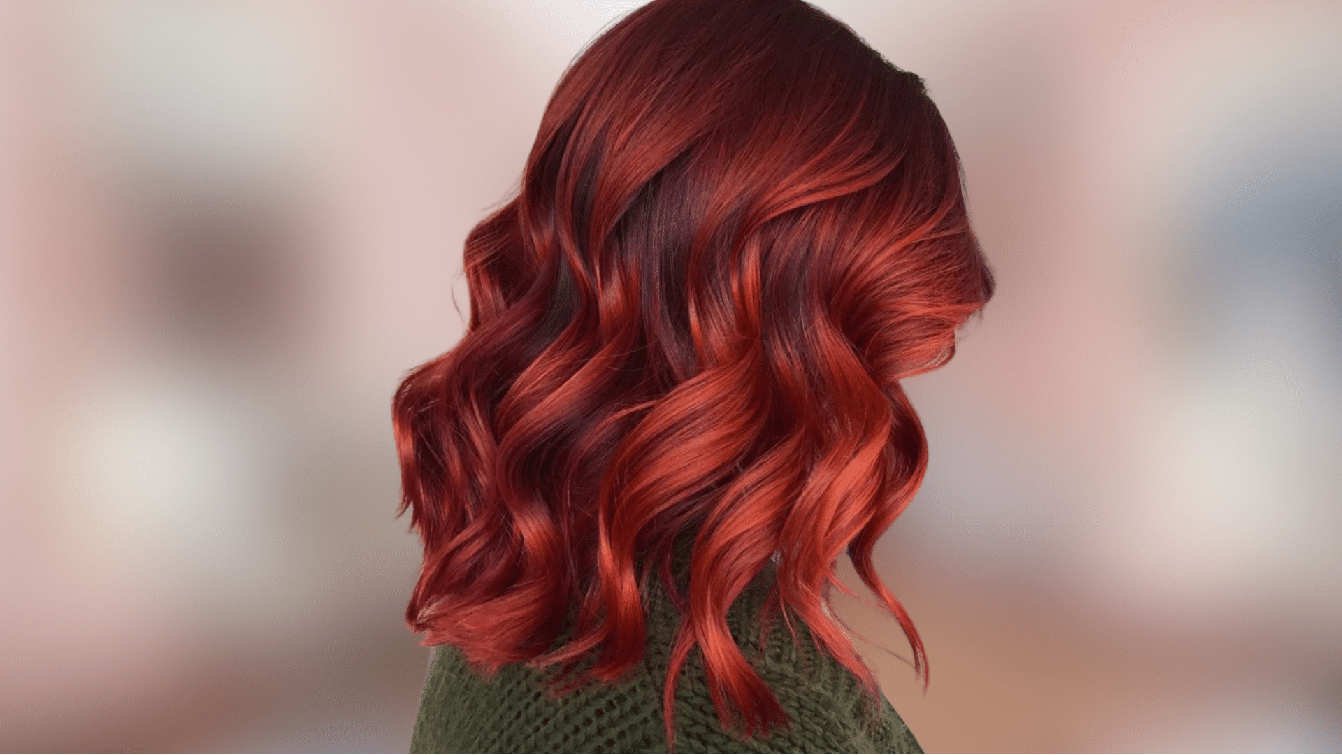 Shoulder length wavy hair displaying rich auburn shade with vibrant copper undertones