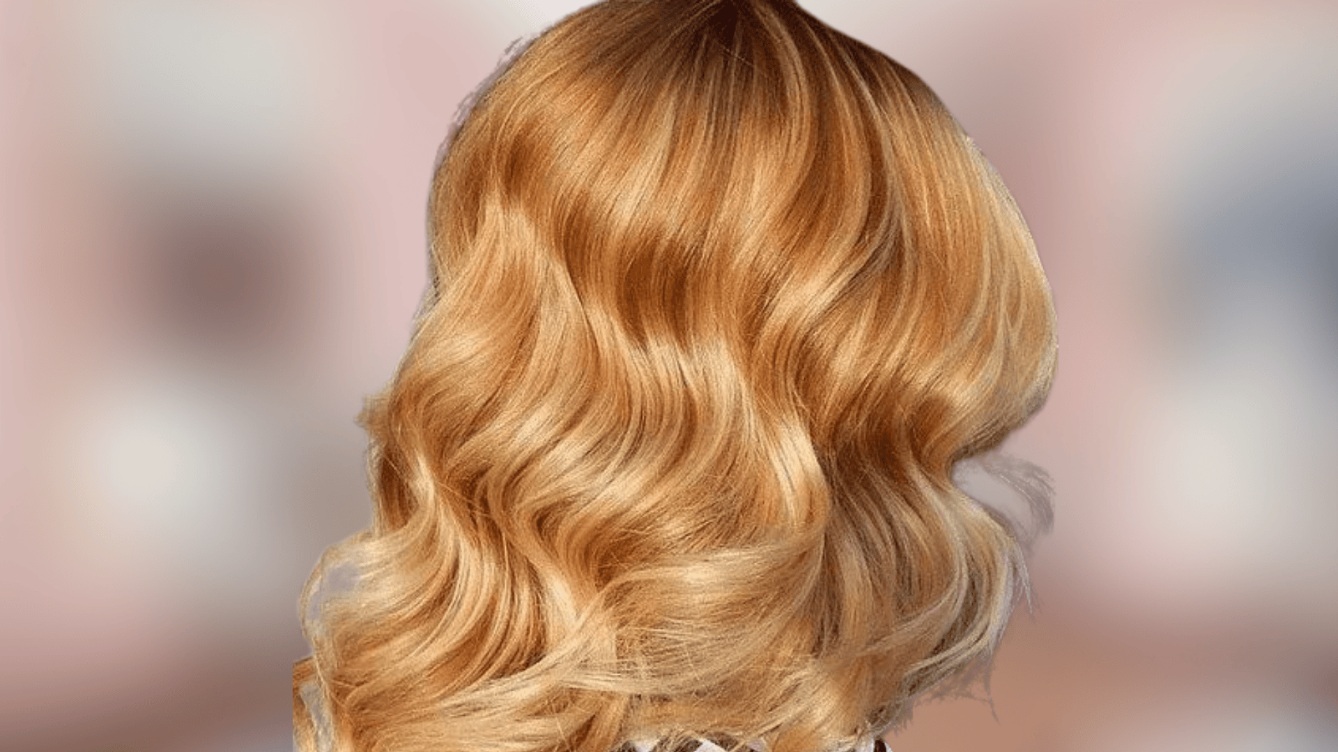 Wavy shoulder length hair featuring bright rich gold blonde with radiant warmth
