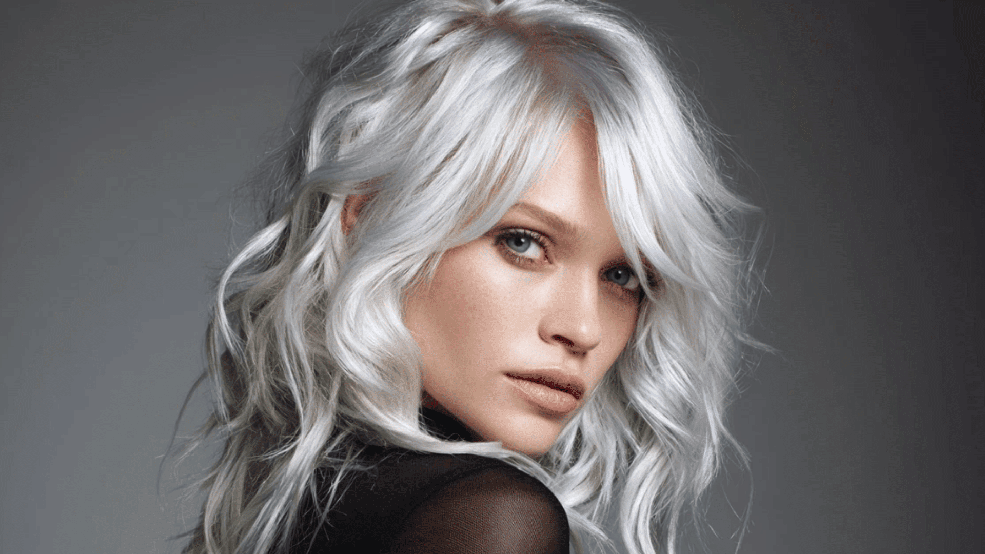 Silver-ash balayage with a metallic finish on pre-lightened hair