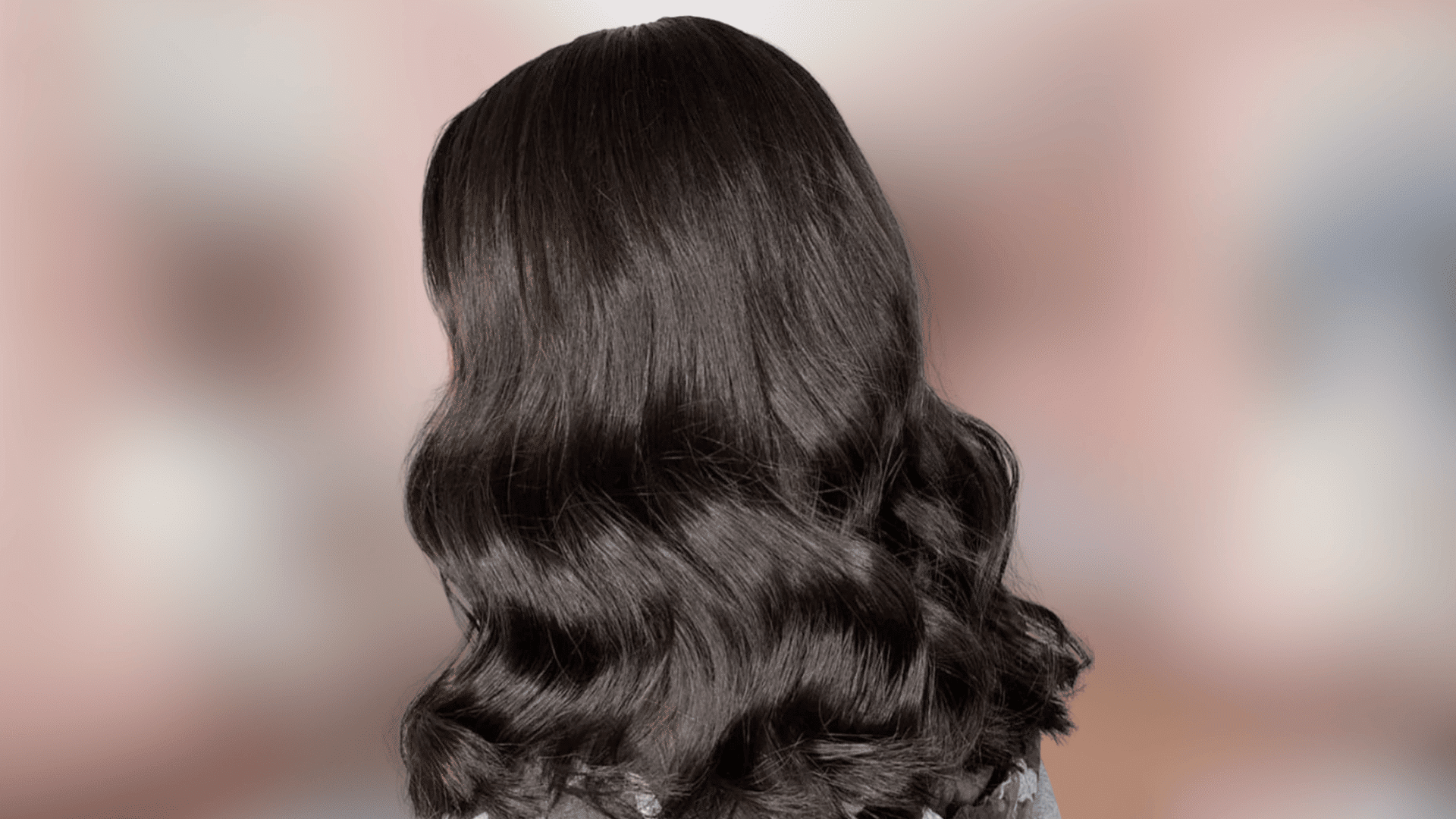 Wavy hairstyle featuring soft black hair color with smooth natural shine