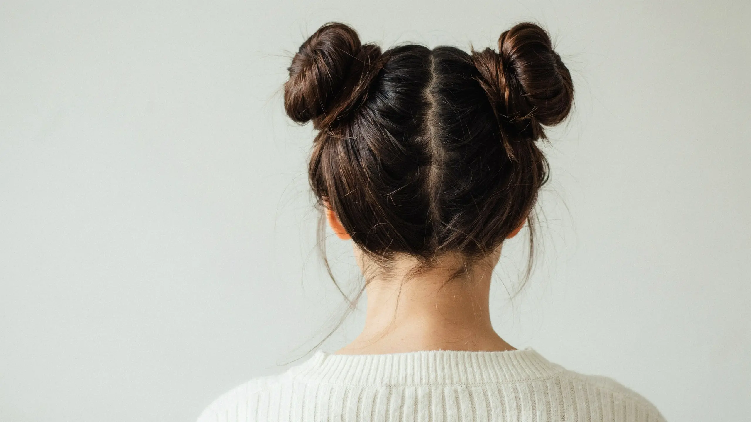 Space buns, a playful choice among cute updo hairstyles
