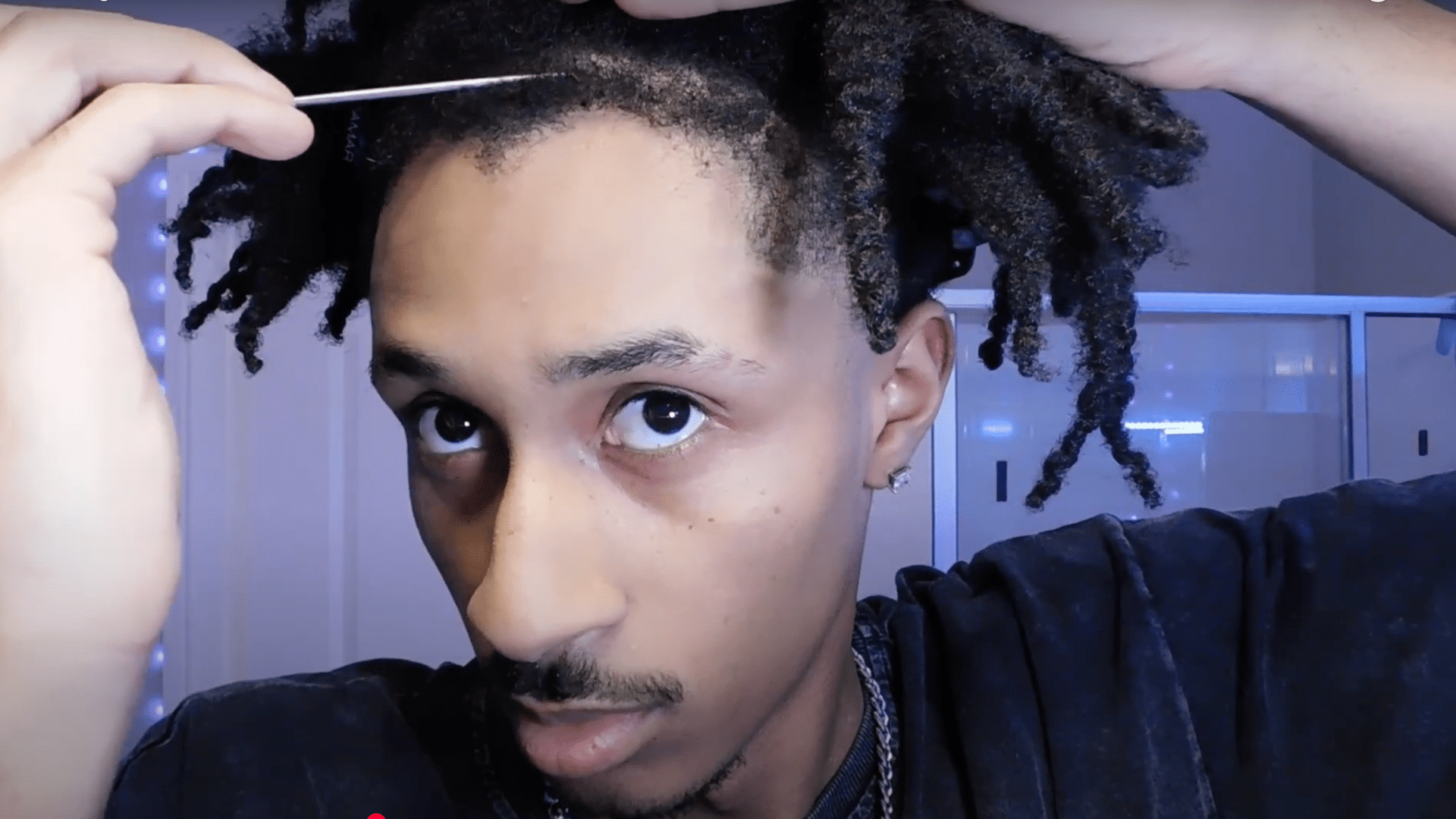 Use a rat tail comb to measure and section the front taper area before cutting for a precise hairline