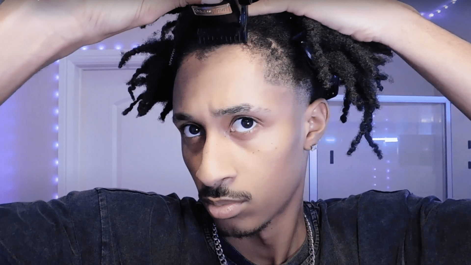 Trim the front taper with clippers and a number one guard using gentle upward strokes for a natural fade
