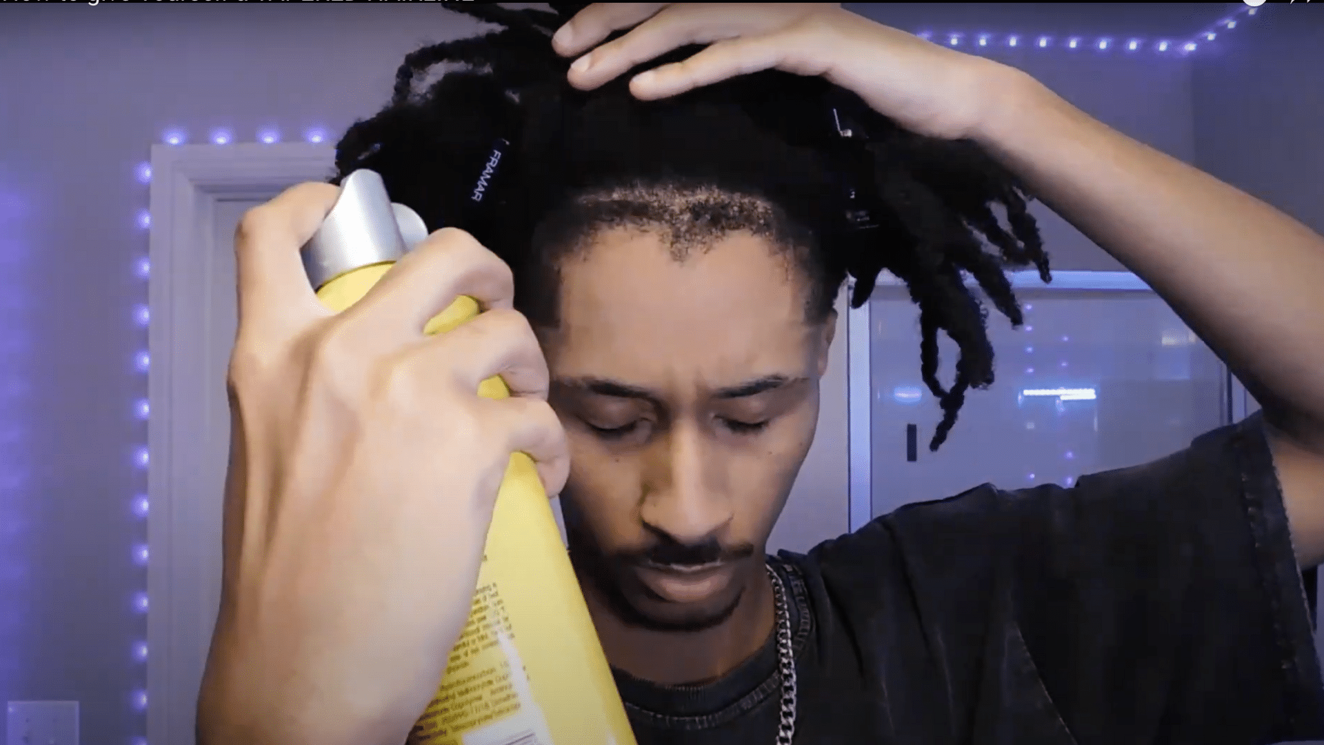 Spray holding product onto the front taper to keep hair in place before making final shape adjustments