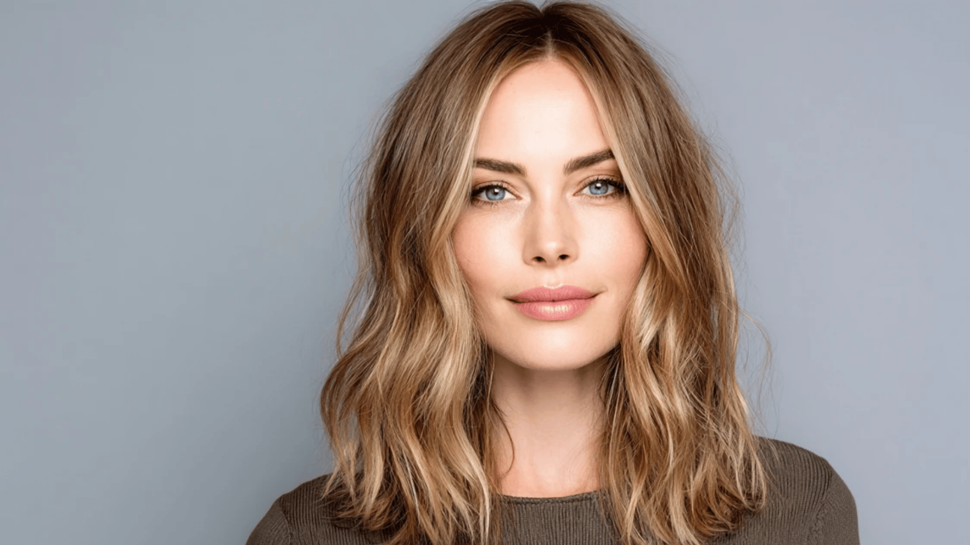 Ash brown balayage with soft face-framing highlights for a natural look