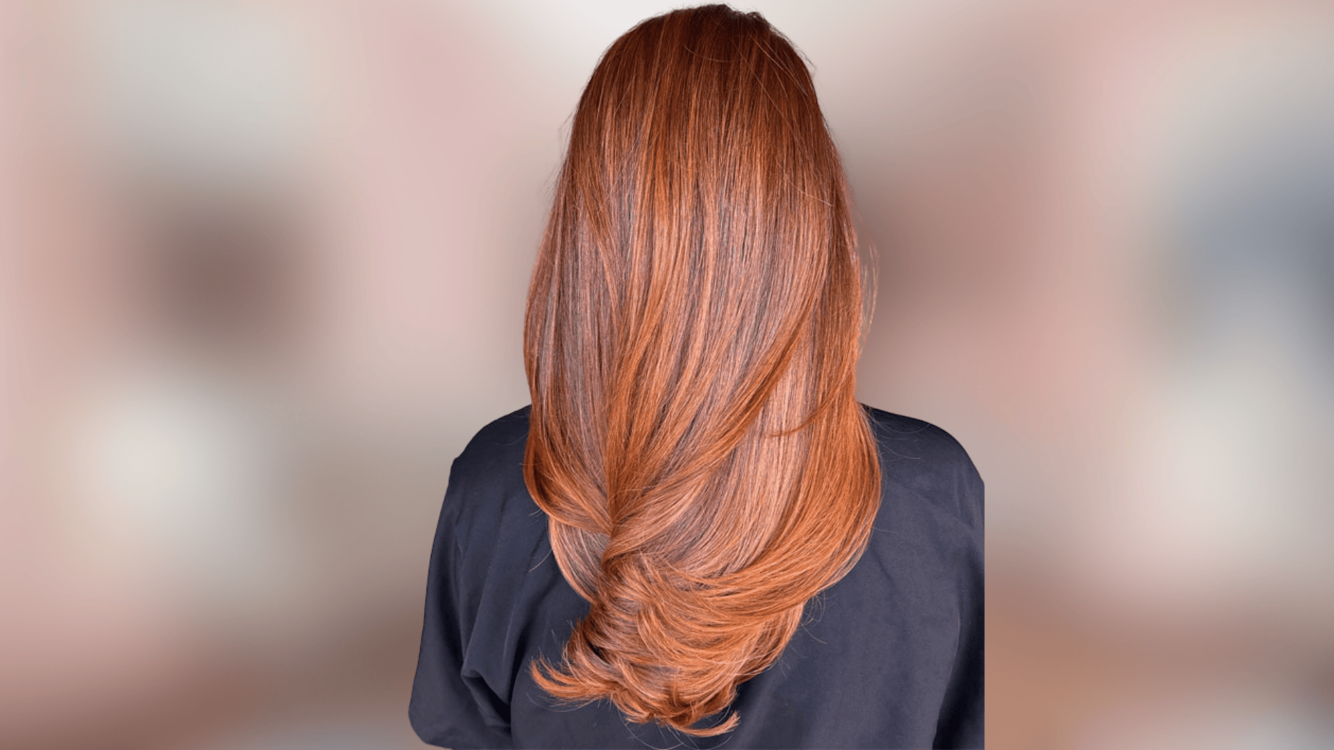 Soft waves featuring sunlit copper hair color with warm golden highlights
