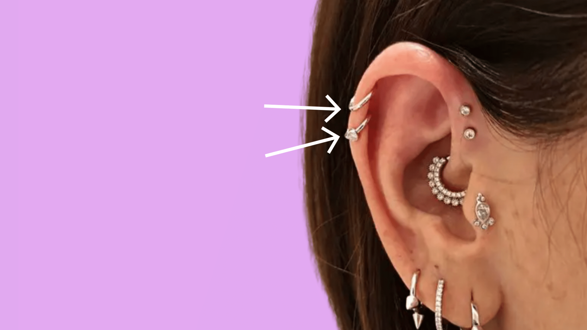 Triple helix piercings spaced along the upper ear cartilage rim