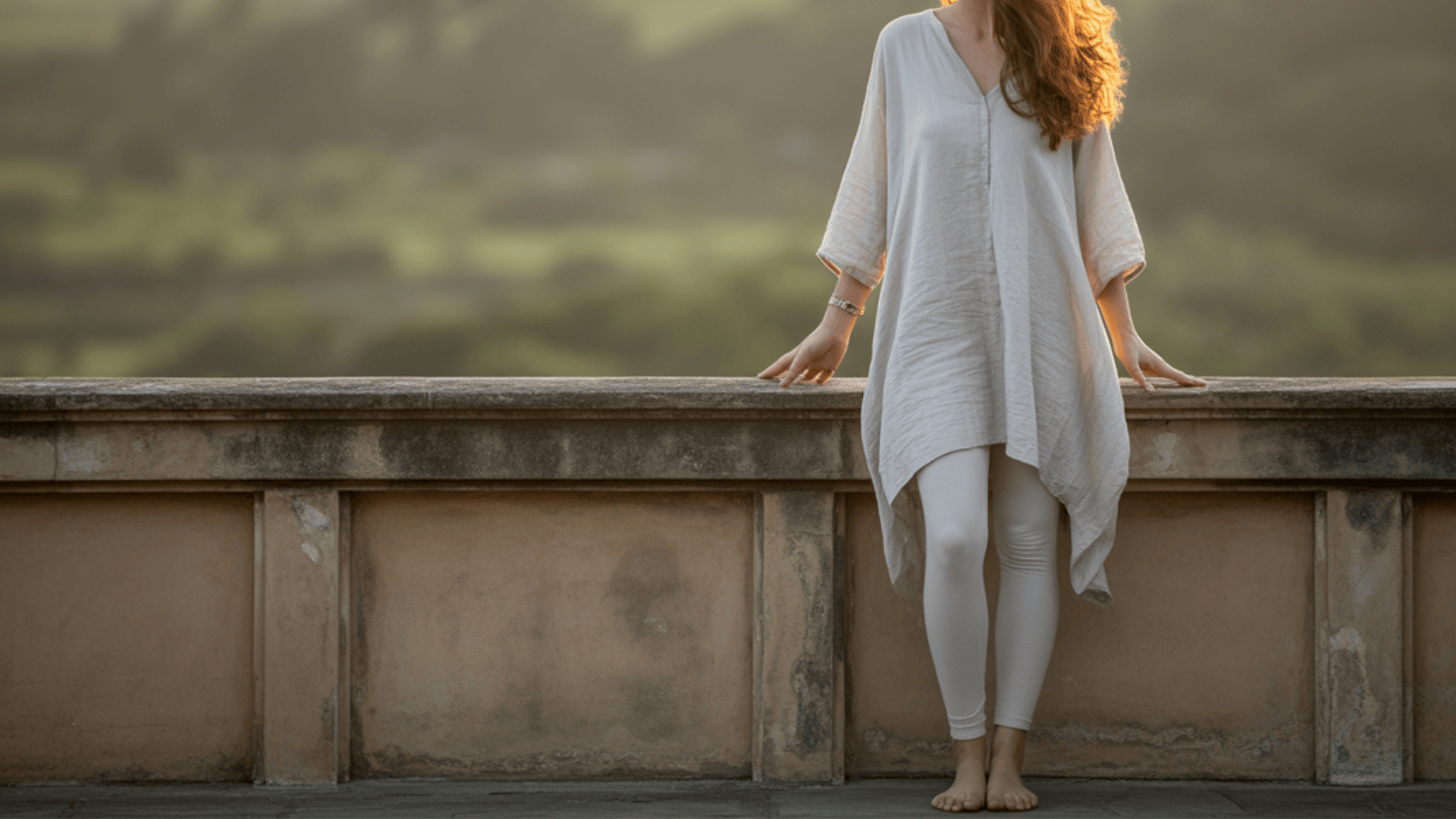Long loose tunic top falling past the hips