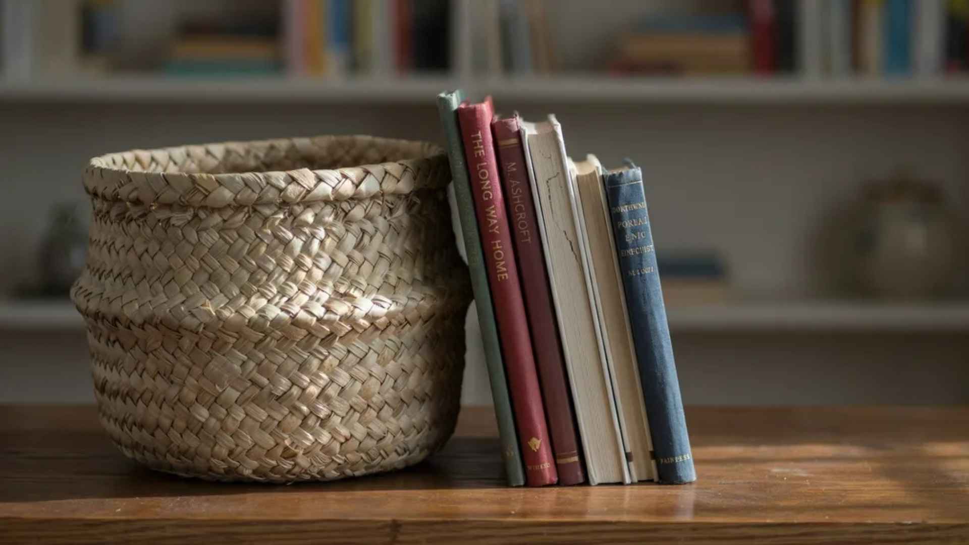Woven baskets on a bookshelf hiding clutter while adding texture