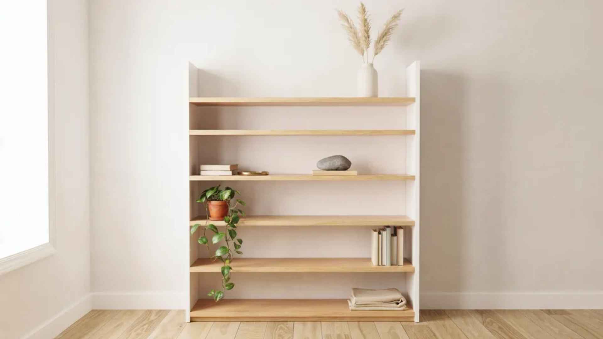 Bookshelf with open negative space left between styled objects