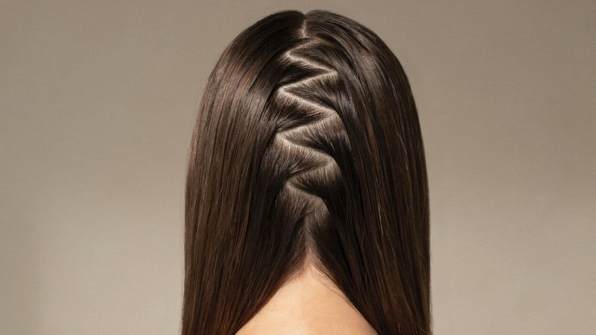 Early 2000s hairstyle featuring a zigzag part with sleek straight hair flowing down.