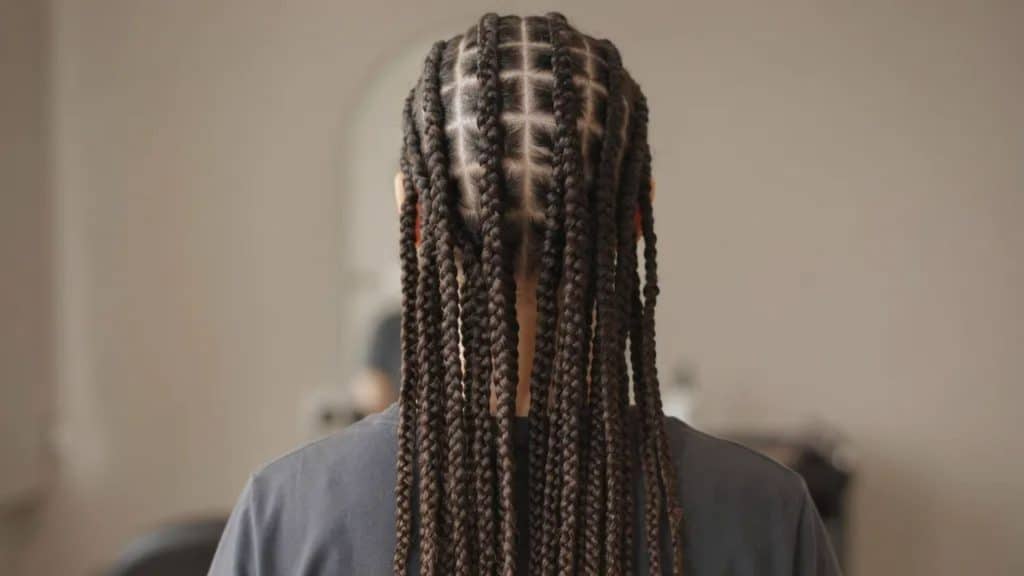 Back view of knotless box braids showing natural looking roots and lightweight seamless braid sections