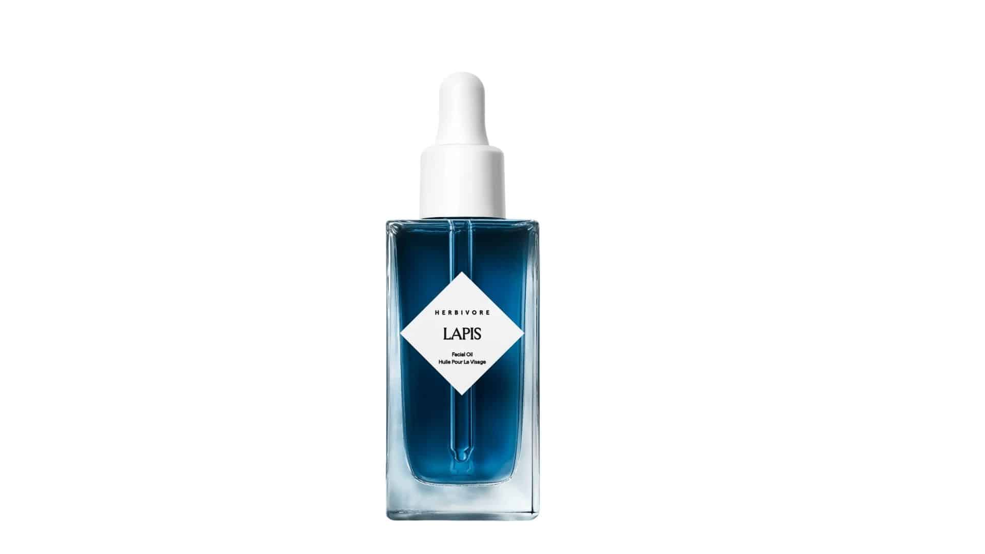 A glass bottle of Herbivore Lapis Facial Oil with a white dropper cap.