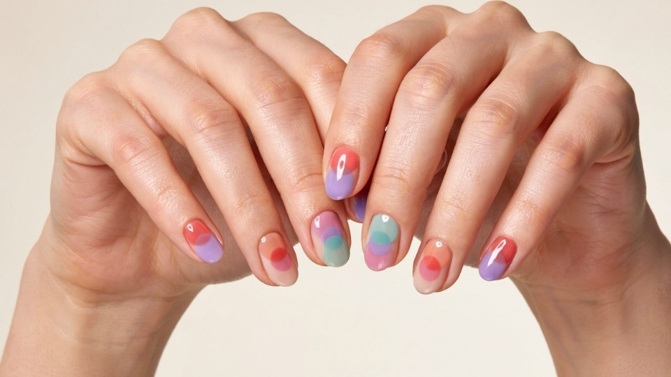 Round nails featuring colorful airbrushed circles with soft edges and glossy finish
