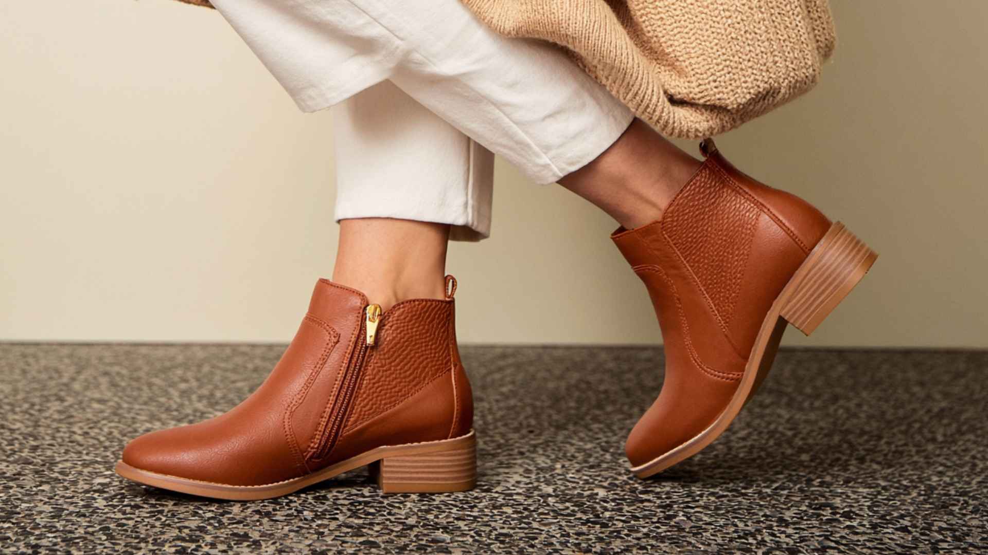 Brown zip up western boots with short shafts and low heels designed for easy everyday styling