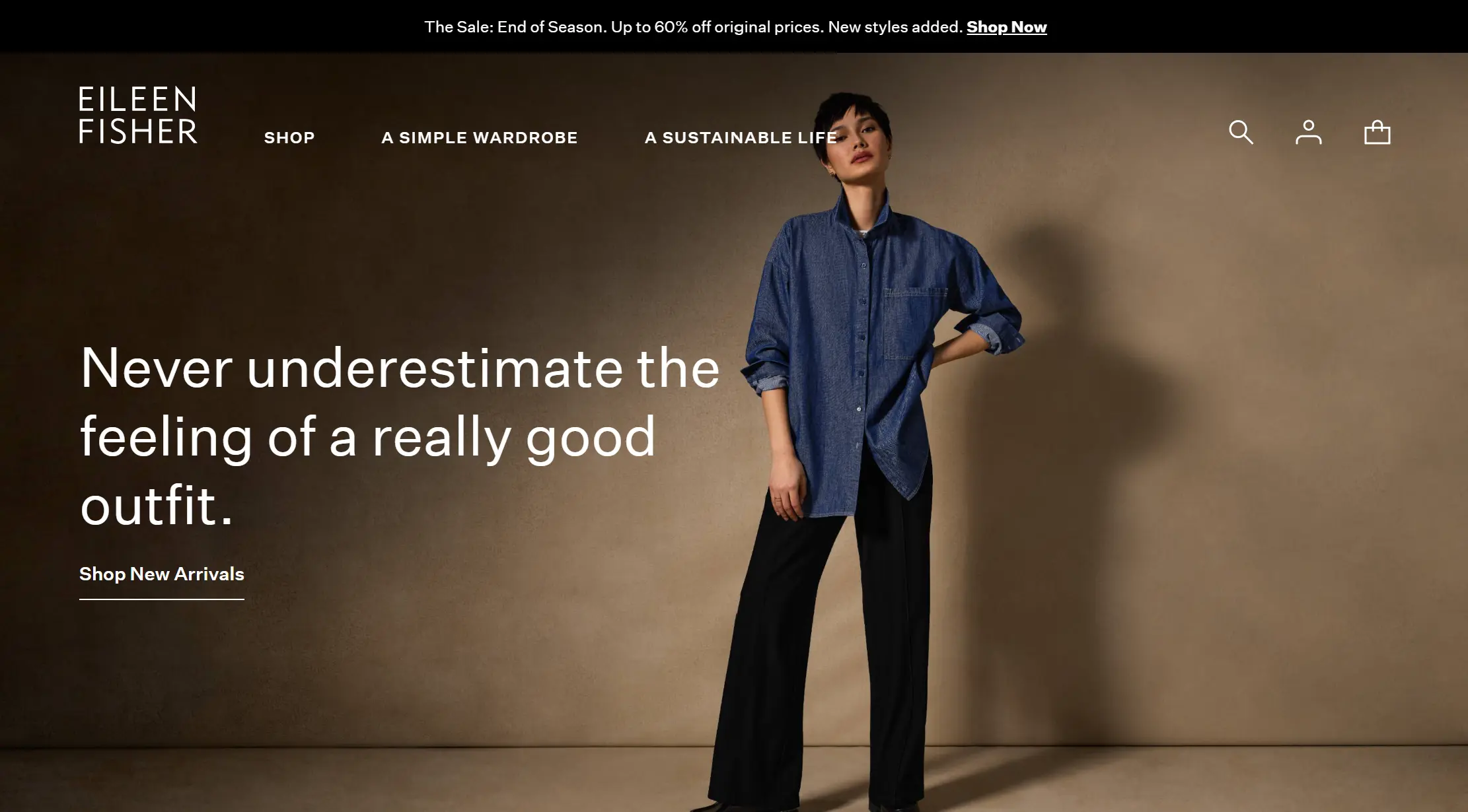 **Eileen Fisher Homepage** Model in a blue denim shirt and black pants with