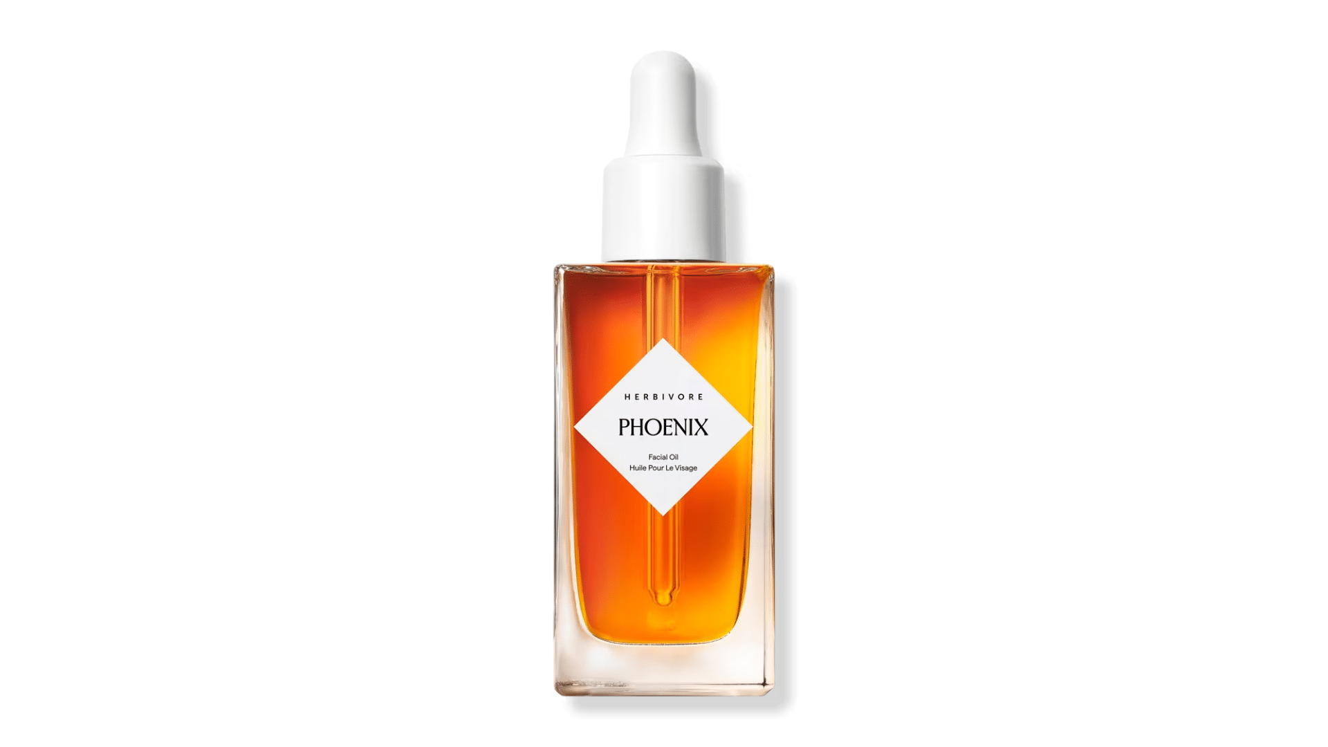 Herbivore Phoenix facial oil bottle with amber liquid and clear glass packaging displayed on a clean white background