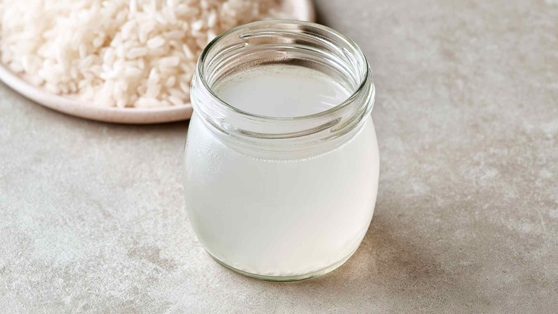 Jar of fermented rice water prepared for hair care