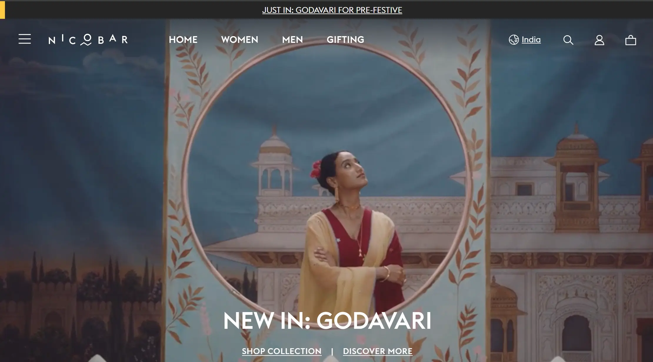 **Nicobar Homepage** Woman in traditional attire framed by a floral arch with